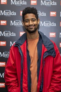 Press shot of Alfred Enoch attending the Matilda the Musical 10 year anniversary